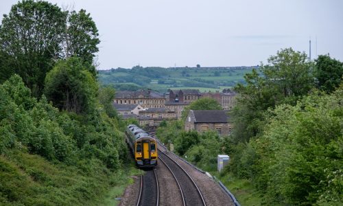 a train traveling through a lush green countryside