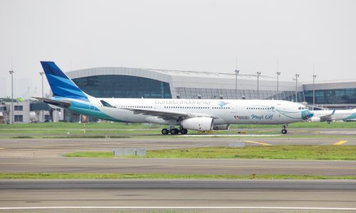 a large passenger jet sitting on top of an airport runway