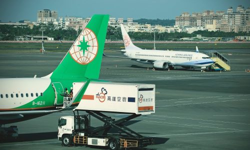 A large jetliner sitting on top of an airport tarmac