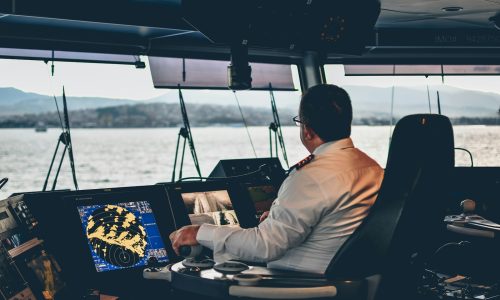 man in white dress shirt sitting on black chair